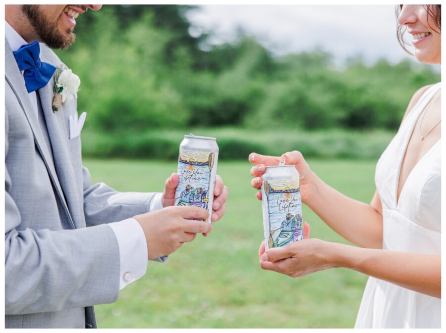 Bride and groom opening customized beer at Branch and Blade Brewing Company