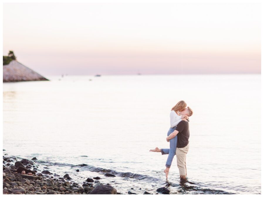 A couple kissing in the ocean at The Knob Engagement Session Falmouth, MA Cape Cod