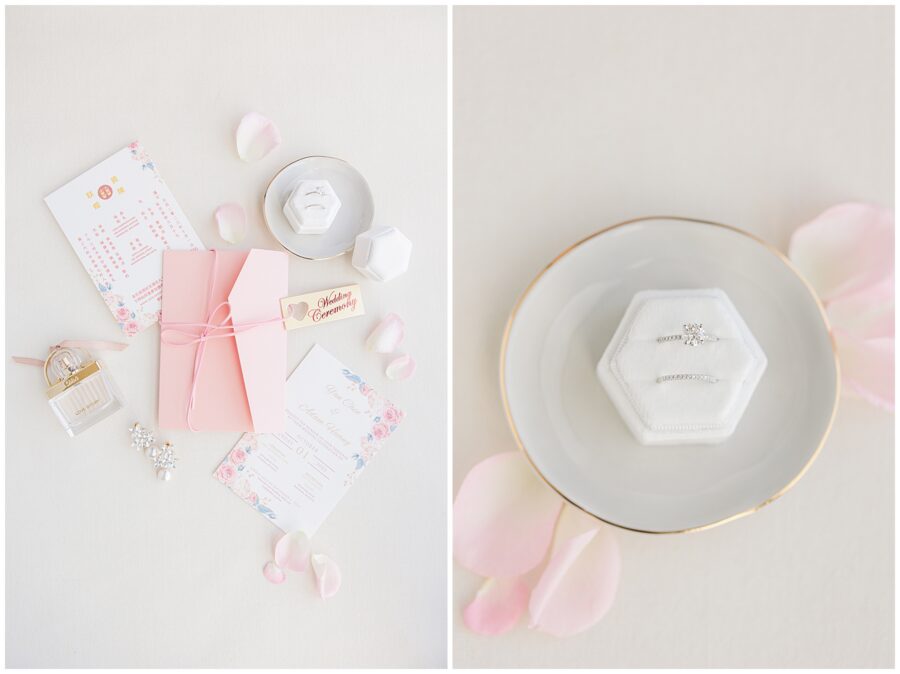Wedding invitations and an engagement ring and wedding band on a ring dish