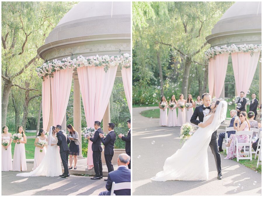 Bride and groom share their first kiss during wedding ceremony