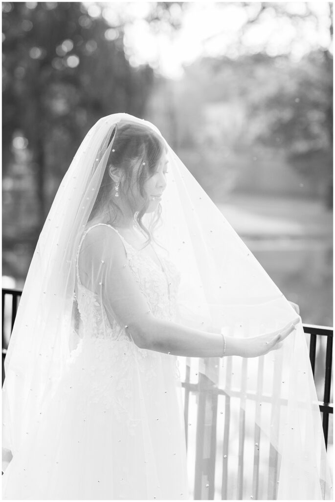 Bride with wedding veil covering her face