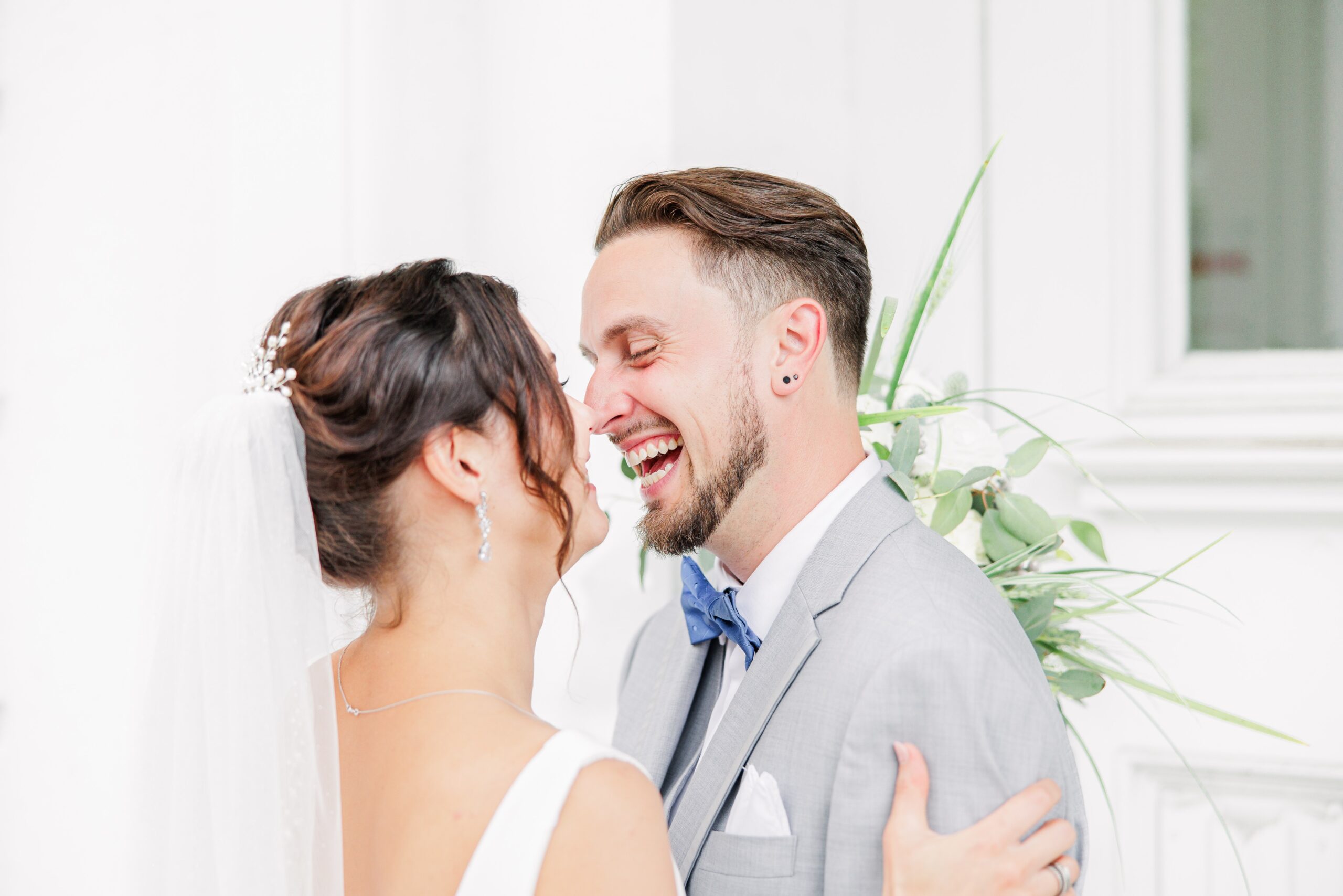 Bride and groom laughing during first look