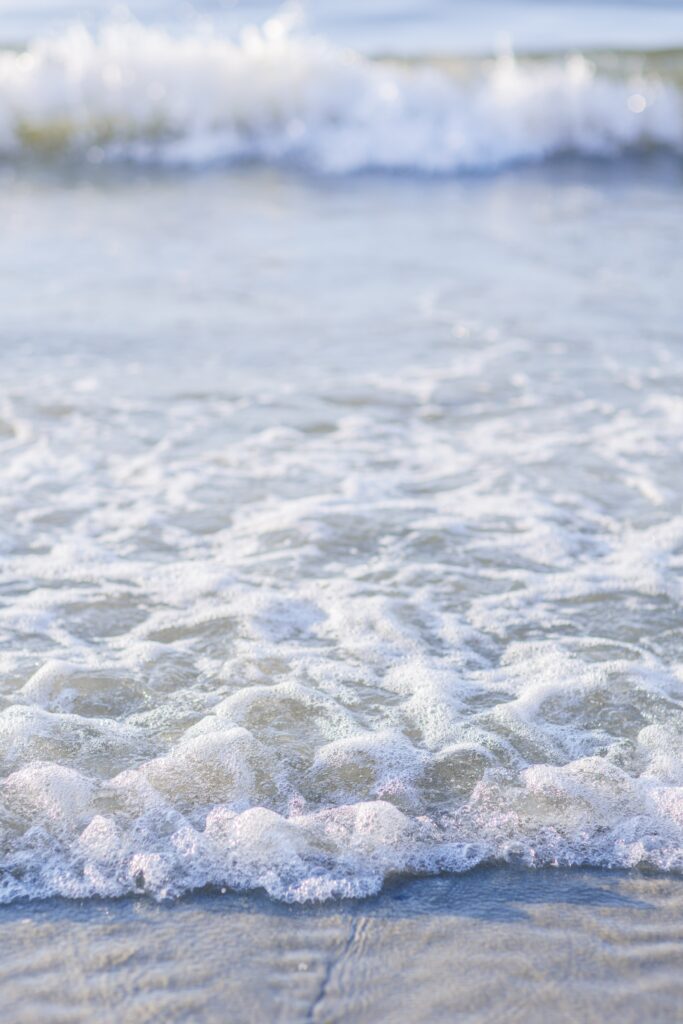 Ocean waves bubbling representing Cape Cod beach weddings