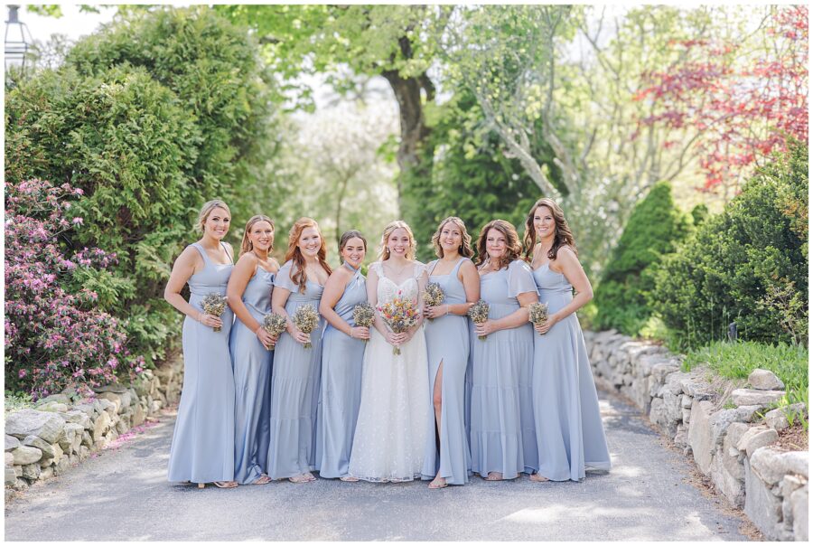 Bride and bridesmaids smiling at the camera during a Bedford Village Inn wedding
