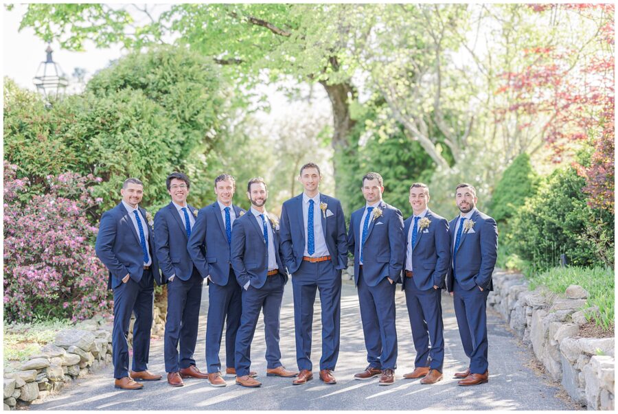 Groom and groomsmen smiling for the camera