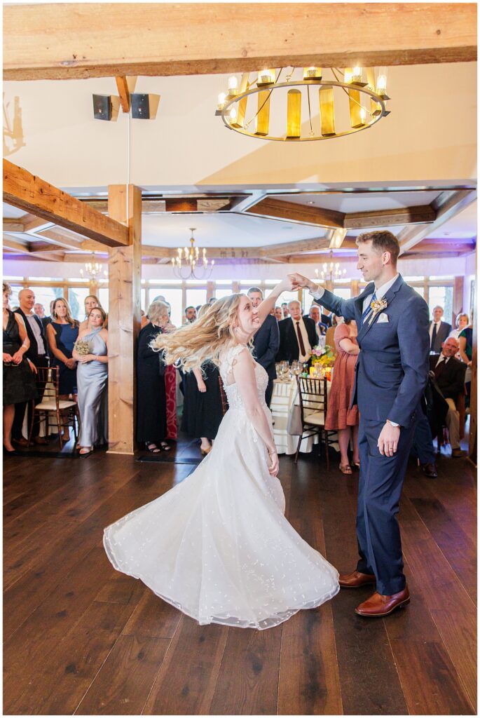 Groom spinning the bride during their first dance at their Bedford Village Inn wedding