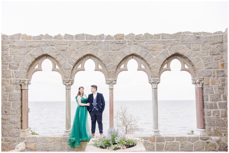 Couple standing in the arched windows at Hammond Castle