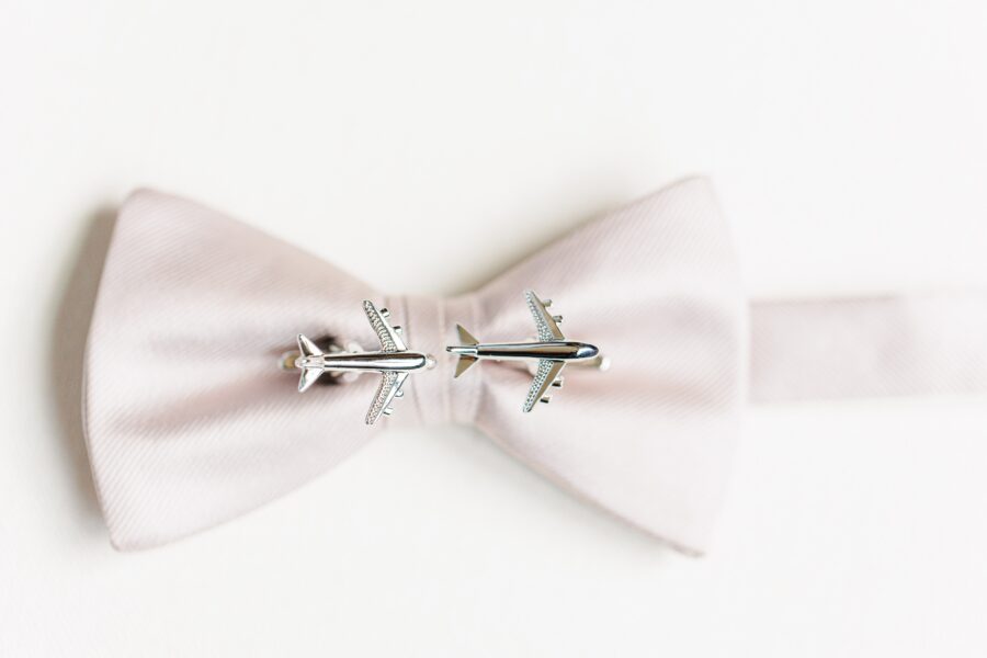 Airplane cufflinks on a bow tie representing a Boston wedding photographer portfolio
