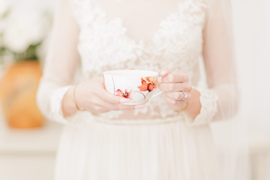 Close up of a bride holding a tea cup representing Cape Cod wedding photography