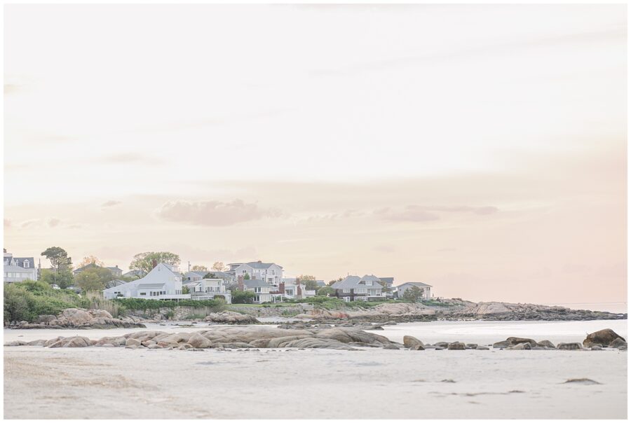 Landscape of Wingaersheek Beach with sand and rocks and coastal homes