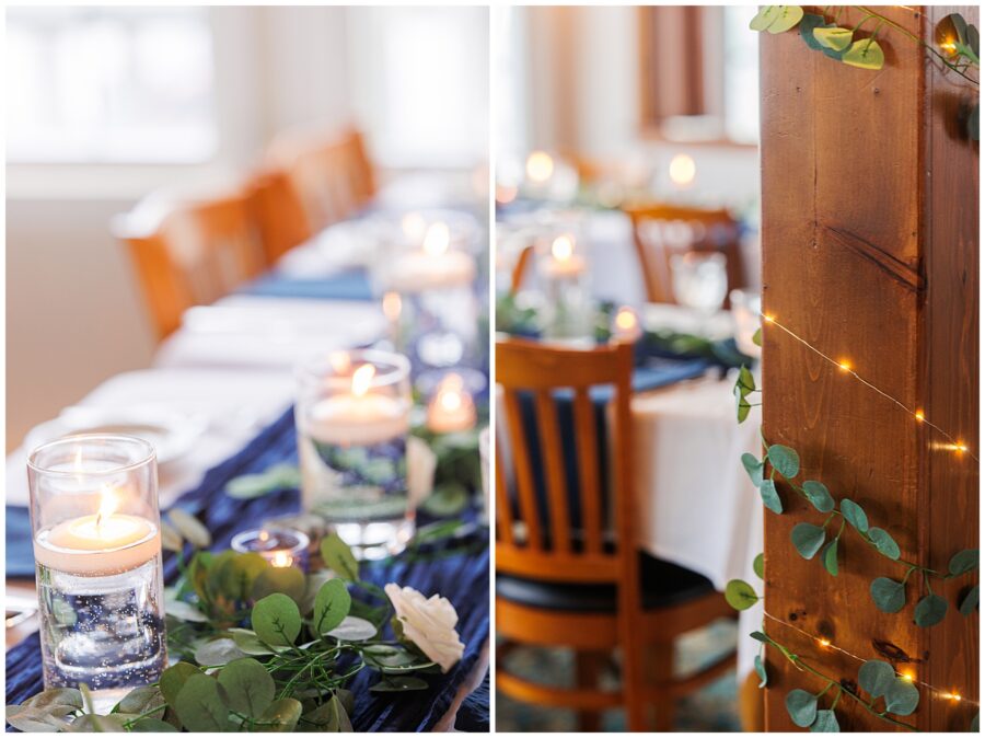 Candles and greenery decorating a long reception table with wooden chairs and a pillar wrapped in string lights.