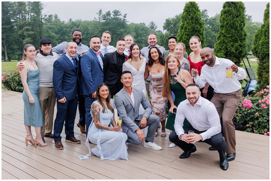 Group of guests posing on a deck at Cape Club of Sharon.