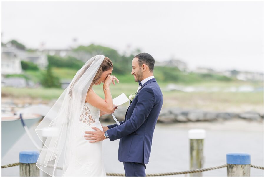 Bride wiping tears during vows at Wychmere Beach Club.