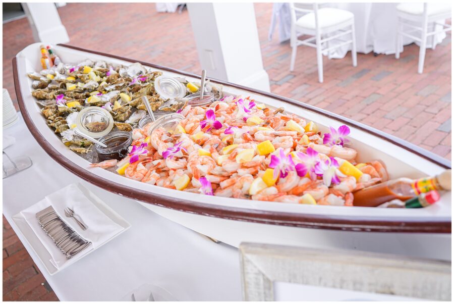 Shrimp and oysters displayed in a boat at the wedding reception.