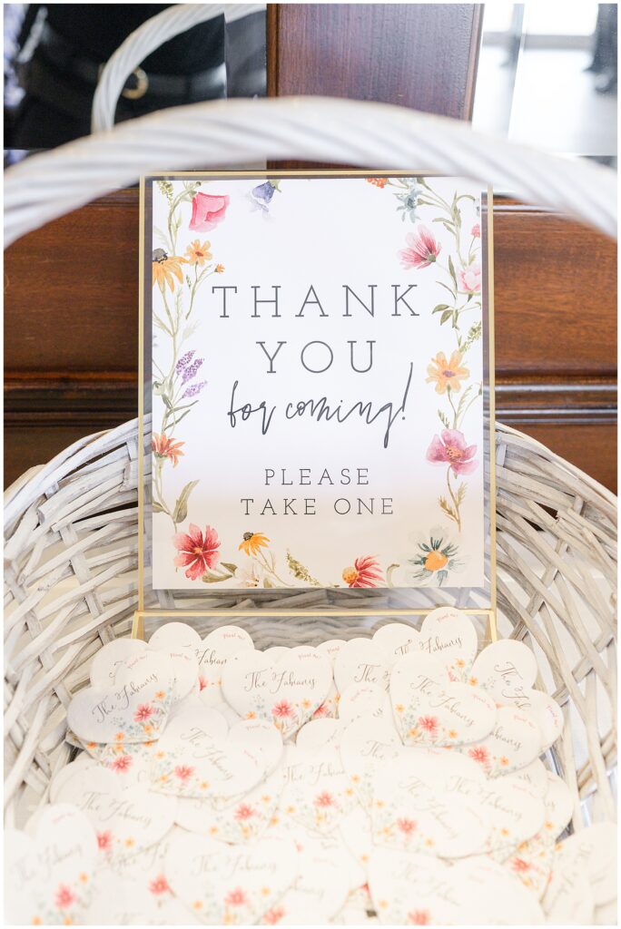 White rose and flower arrangement in a glass vase at the wedding reception.