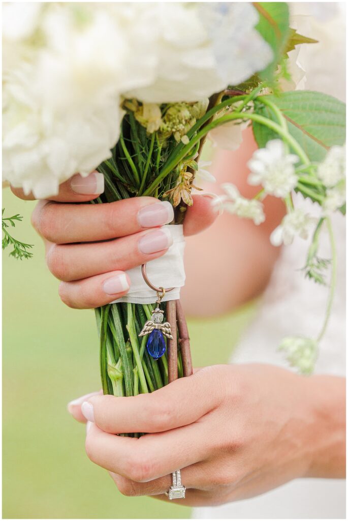 Close up of a wedding bouquet charm.