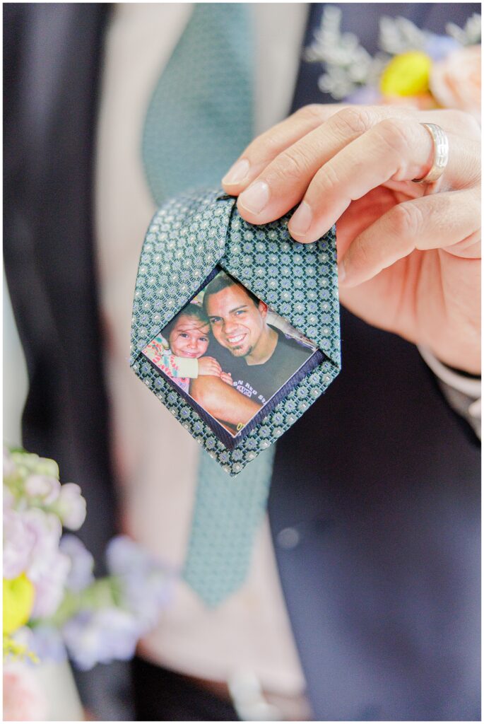 Close-up of the father’s tie at Pembroke Pines Country Club, revealing a small photo of the bride as a child, tucked inside the tie.