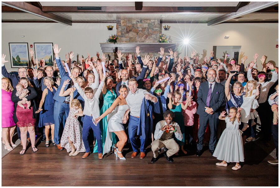 Wedding party smiling and cheering during reception at Pembroke Pines Country Club.