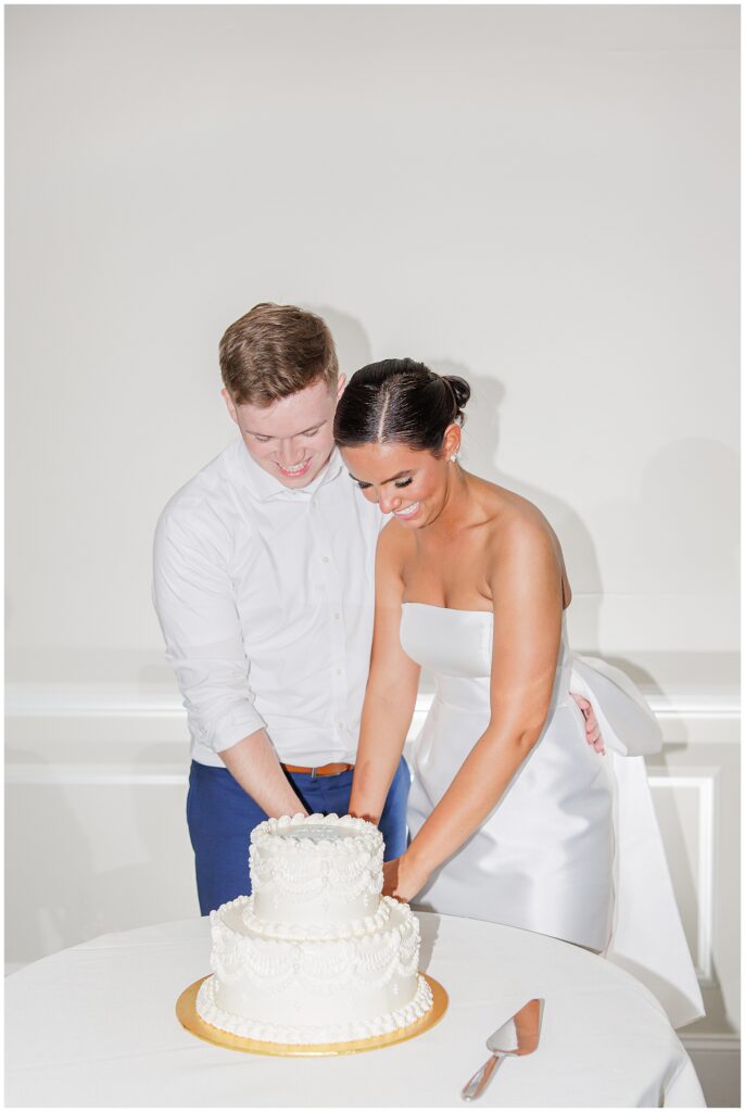  Bride and groom cutting their cake at there New Hamshire wedding reception