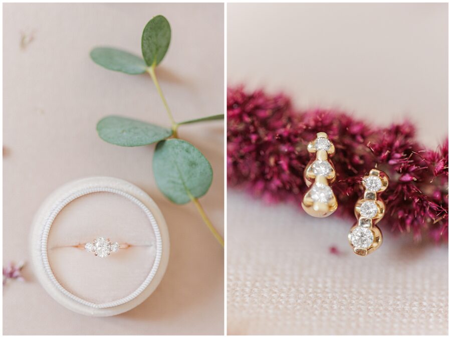 Wedding ring and earring detail – Close-up of a round-cut diamond engagement ring in a white velvet box with a eucalyptus leaf resting beside it (left). A pair of gold earrings with diamonds and pearls is displayed against a background of red autumn foliage (right).