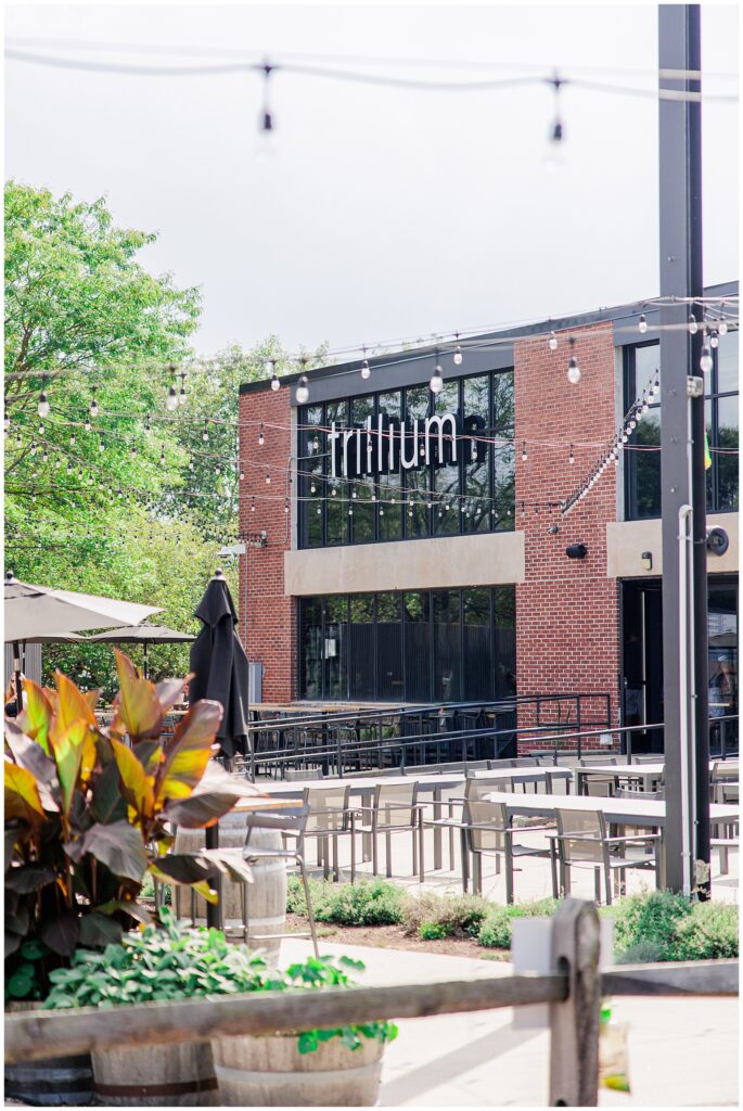 Exterior of Trillium Brewery with outdoor seating and string lights in Canton near Boston, MA.