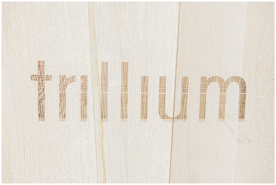 Close-up of the word ‘Trillium’ etched into a wooden barrel.