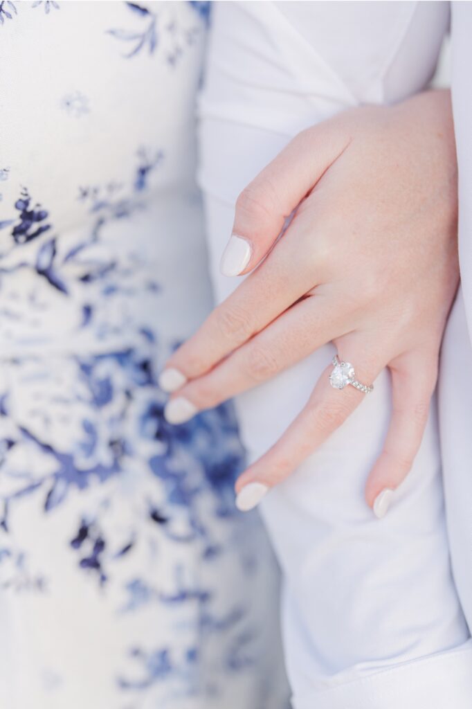     Close-up detail of an oval diamond engagement ring during New Hampshire engagement photos.