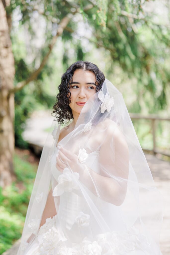 Close-up bridal portrait on a garden bridge during a Heritage Museum and Garden wedding editorial
