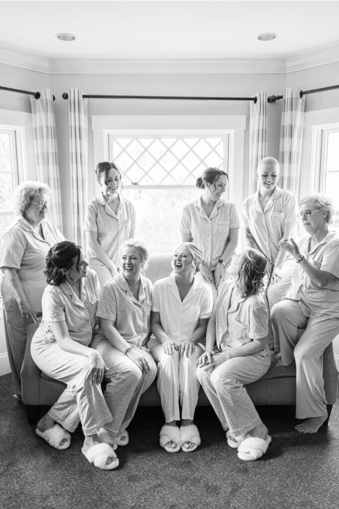 Bride laughing with her bridesmaids and family while getting ready for her Publick House wedding.