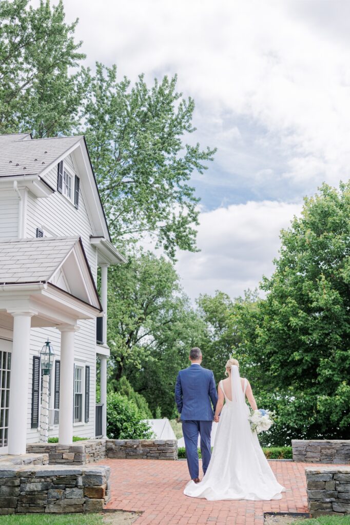 Bride and groom overlook the grounds during their Publick House wedding.