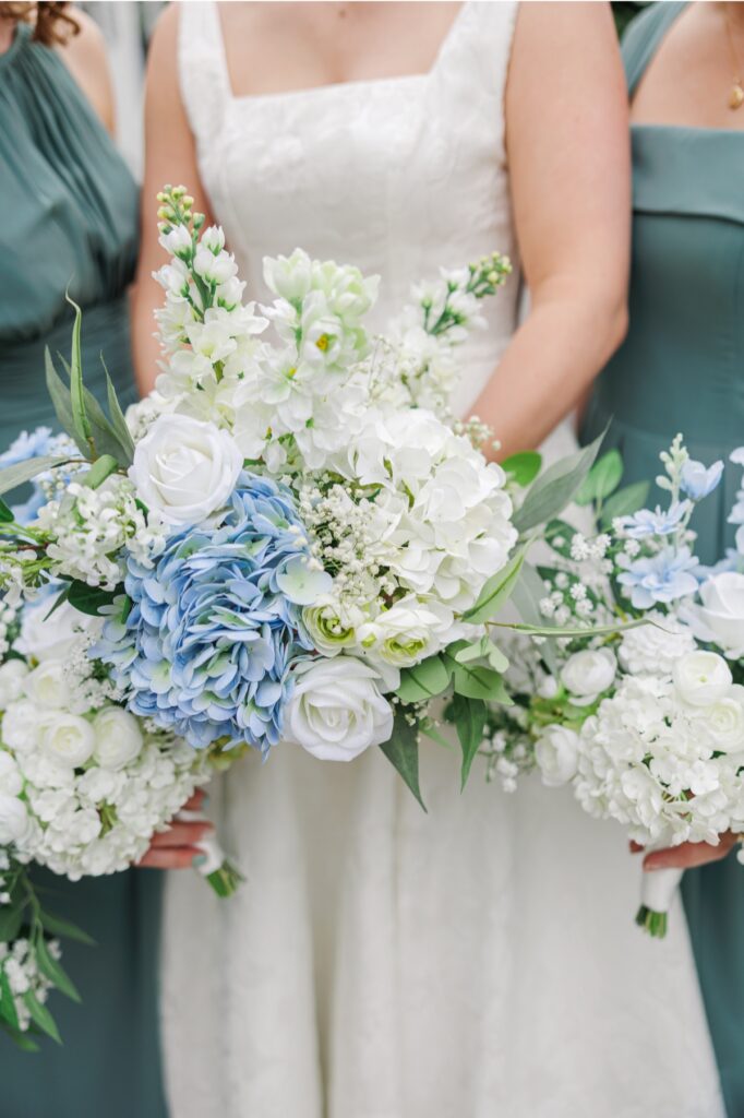 Blue hydrangea and white flower bouquets carried at a Publick House wedding.