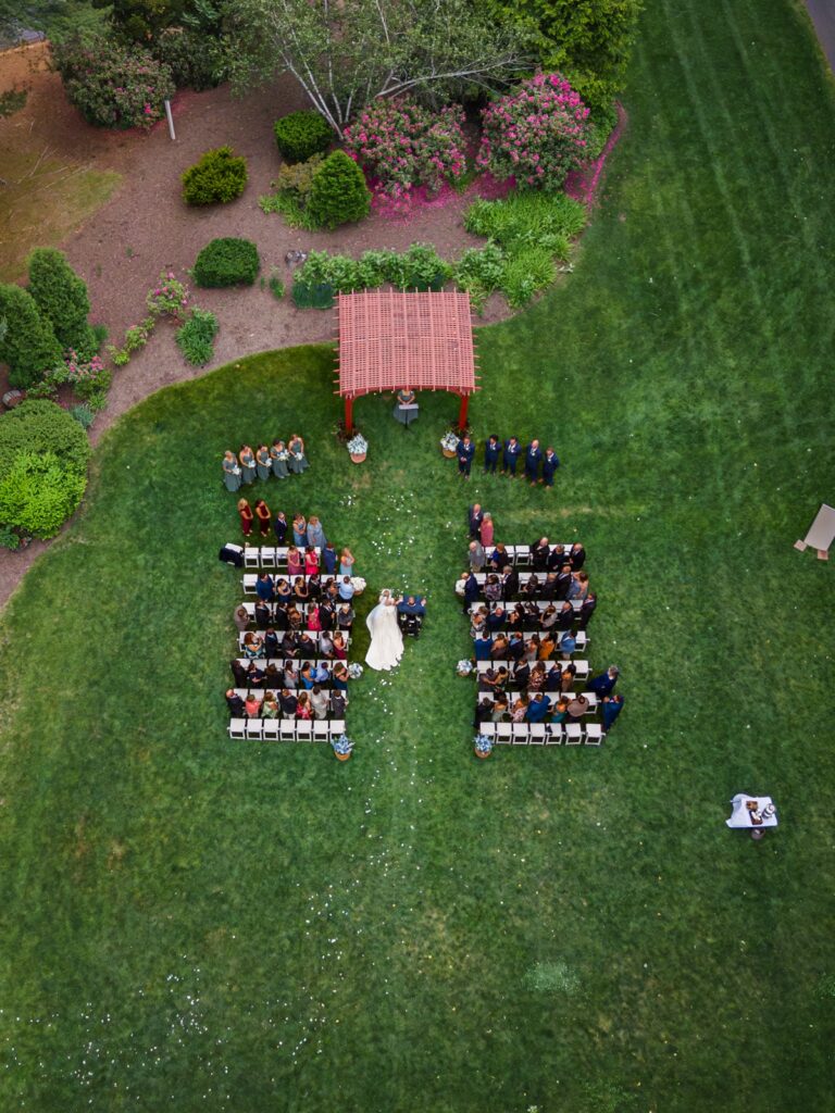 Aerial view of an outdoor Publick House wedding ceremony on the lawn.