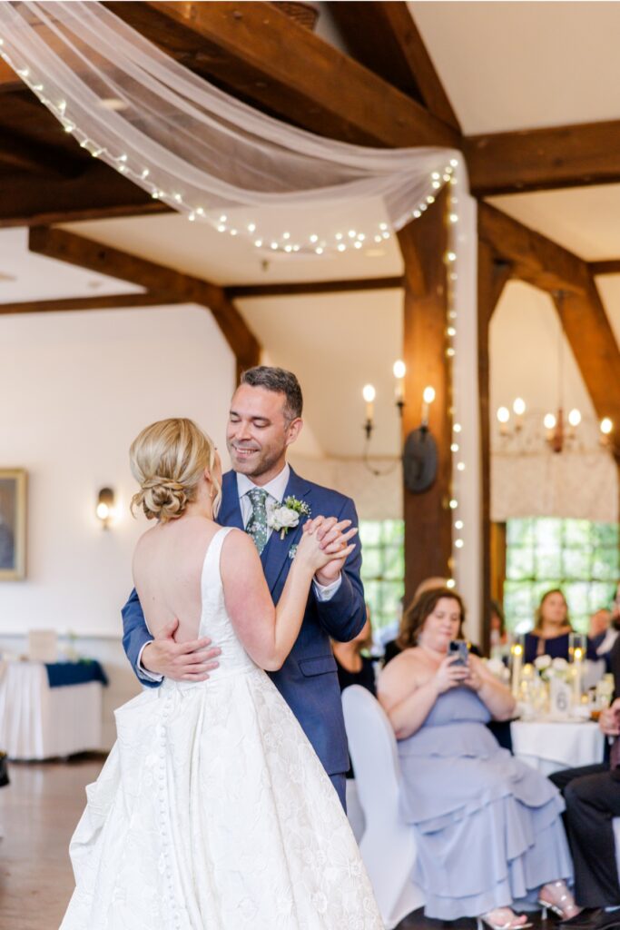 Newlyweds share their first dance during their Publick House wedding reception.