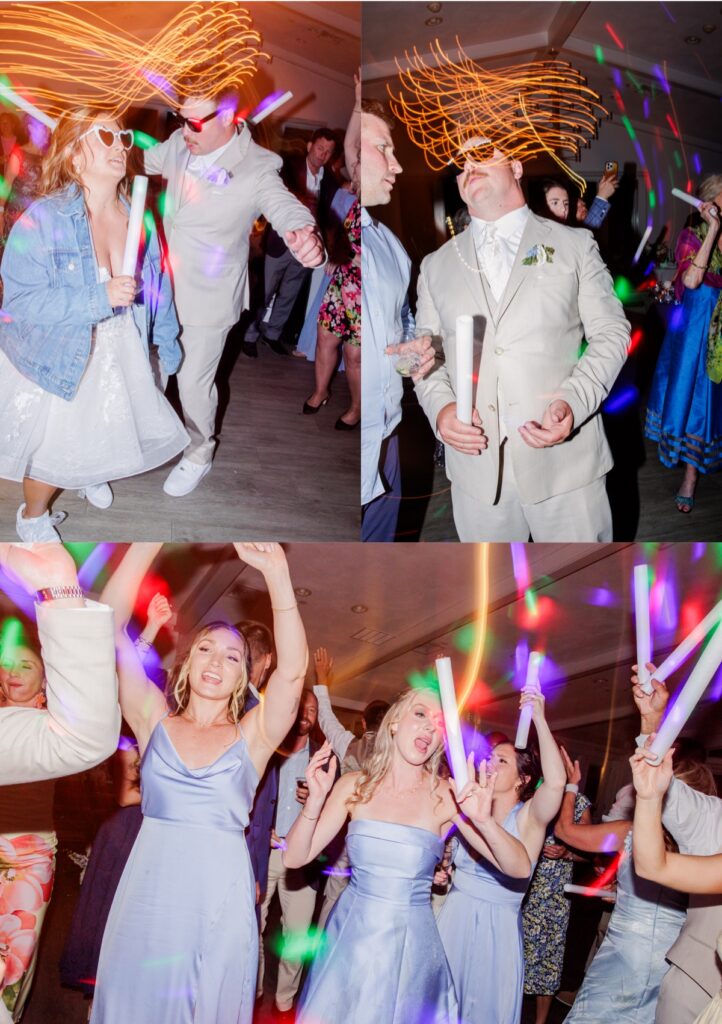 The bride and groom dance together wearing fun sunglasses while waving glow sticks as colorful party lights fill the reception. Guests surround them on the dance floor at Wychmere, celebrating late into the evening.