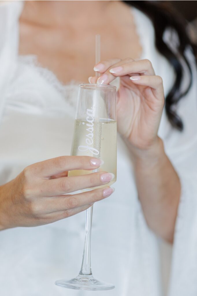 The bride has her makeup finished while getting ready at the Artisan Hotel.