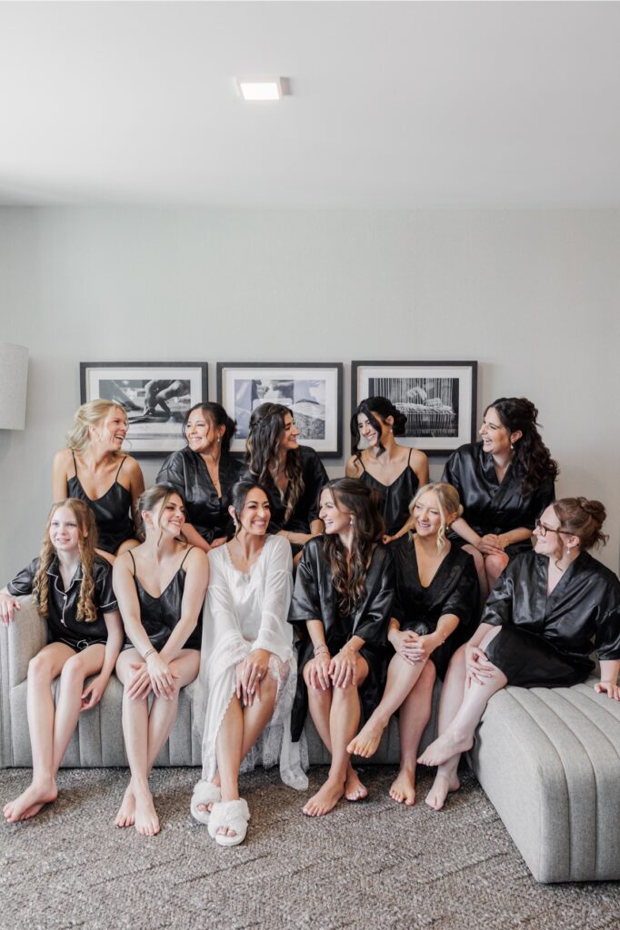 The bride and her bridesmaids gather together during wedding-day preparations.
