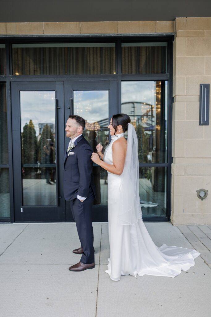 The bride and groom share private vows outside the Artisan Hotel.