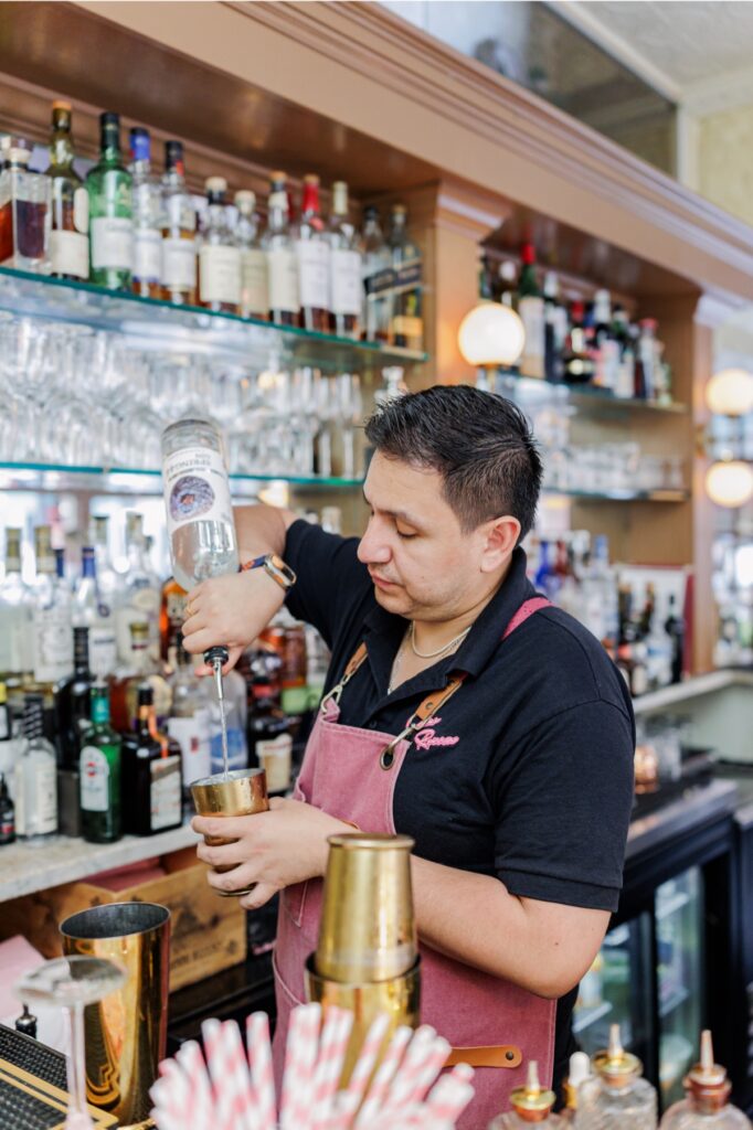 A bartender preparing espresso martinis inside Ciao Roma in Boston’s North End