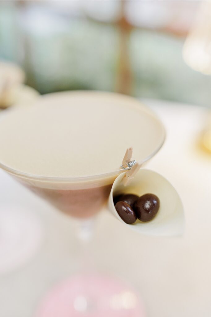Espresso martini garnished with chocolate-covered espresso beans inside Ciao Roma in Boston’s North End