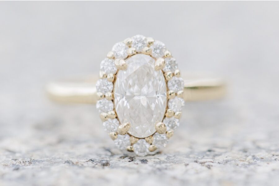 Oval diamond engagement ring photographed along the Boston Harborwalk