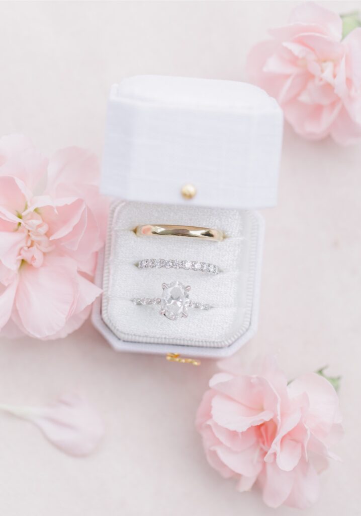Gold wedding band and diamond rings in a pale velvet box for a Salem Country Club wedding.
