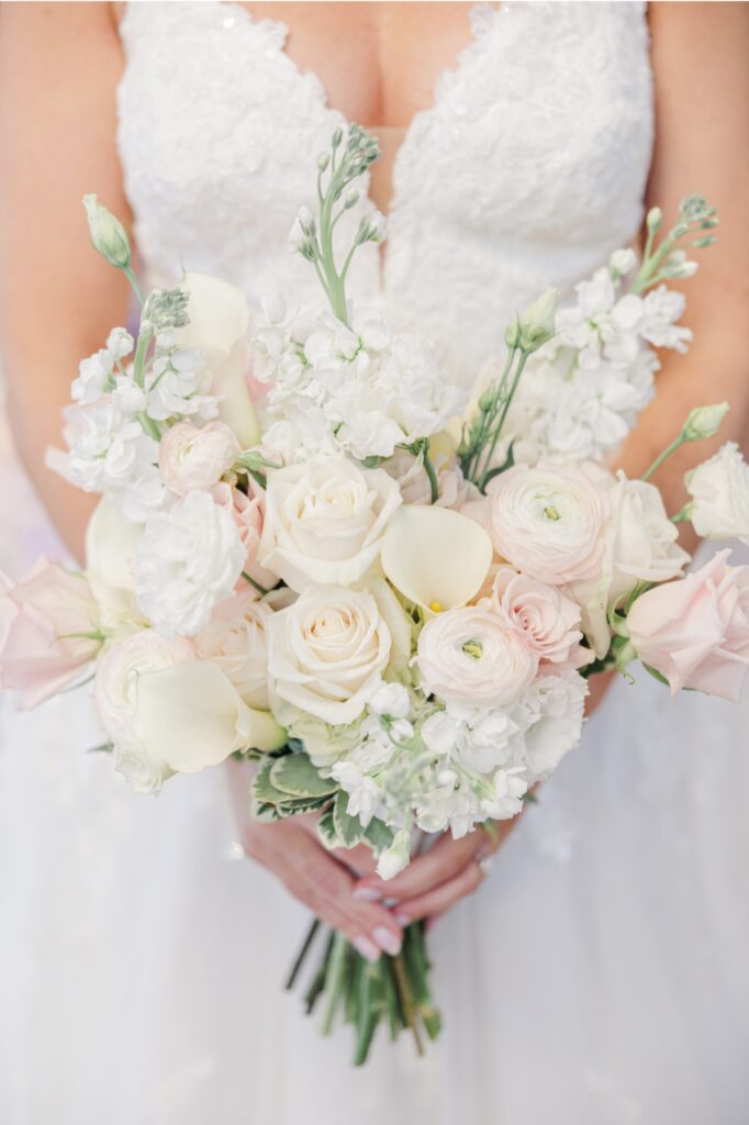 White roses, calla lilies, and blush blooms in the bride’s Salem Country Club wedding bouquet.