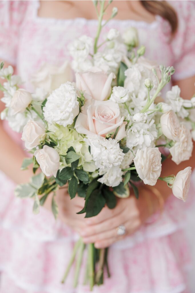 Blush roses, white blooms, and green foliage in a bridesmaid’s Salem Country Club wedding bouquet.