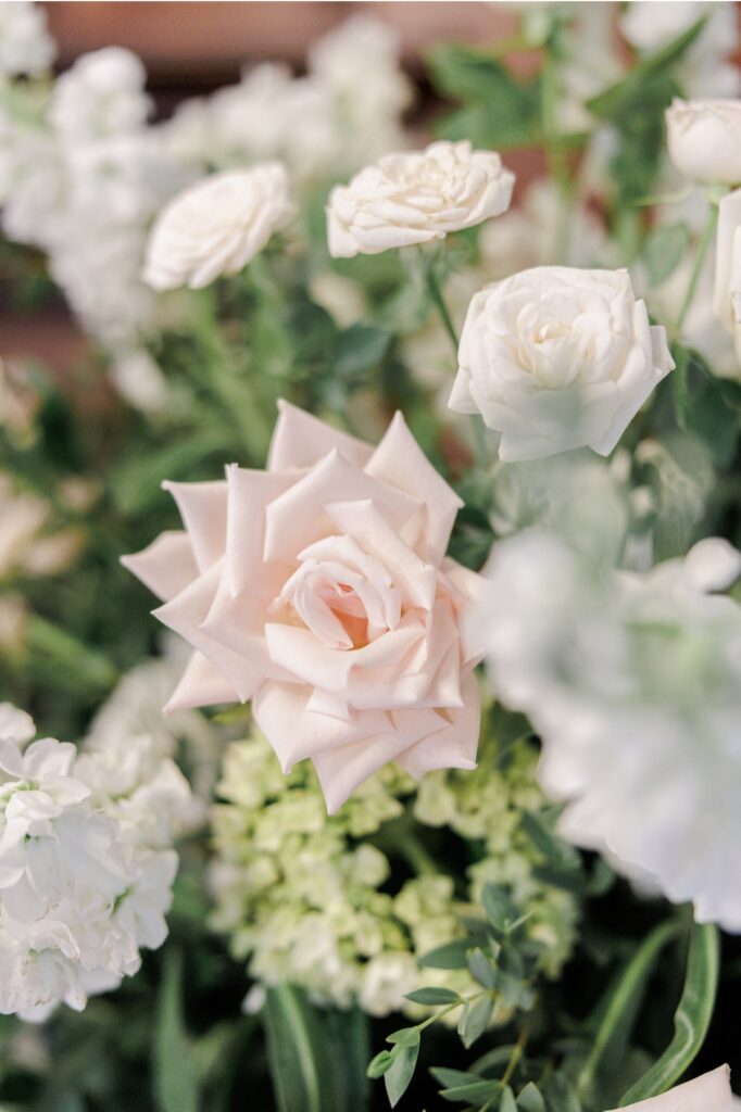 Pale pink and white roses in a Salem Country Club wedding floral arrangement.